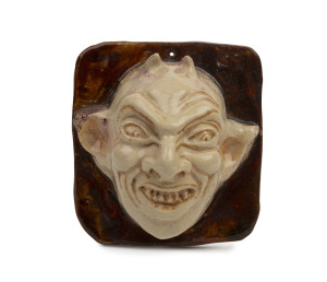 MARGUERITE MAHOOD "Devil" pottery face plaque, incised "M. Mahood, B 394 M", 10cm high, 9cm wide