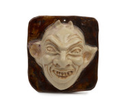 MARGUERITE MAHOOD "Devil" pottery face plaque, incised "M. Mahood, B 394 M", ​10cm high, 9cm wide