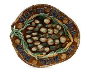 BENDIGO POTTERY bread platter, mottled glaze on brown ground with raised blue lettering, 19th century, 31cm wide