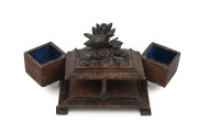 RUDOLPH W. UNGER (Germany, South Australia, 1846-927), rare carved wooden jewellery box in the Black Forest style with unusual pivot swinging compartments, South Australian origin, late 19th century, signed "R. Unger", 14cm high, 18cm wide, 10cm deep - 4