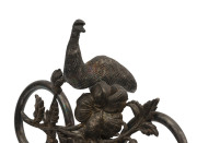 An Australian silver plated emu egg ornament, foliate design with cast emu finial and suspended emu egg carved and decorated with cockatoo and emu in landscape, mounted on ebonised timber plinth, late 19th century, 29cm high. PROVENANCE: Christie's Aucti - 3