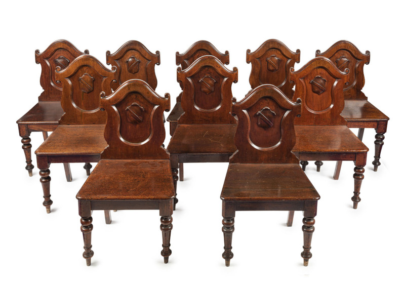 A rare set of ten Australian cedar hall chairs with carved shield backs and turned legs, Melbourne, Victoria origin, circa 1885