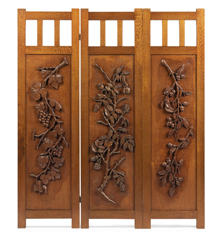 DAVID BRYCE, HARVEY SCHOOL: An Australian three-fold screen, silky oak and eucalypt, with finely carved panels, adorned with gum nuts and gum leaves, thorns and roses, grapes and vines, Queensland origin, circa 1930s, 170cm high, 145cm wide