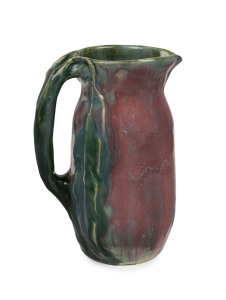 PHILIPPA JAMES green and pink glazed pottery jug with gum blossom and leaf decoration, incised "Philippa James", ​16cm high