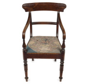 A Colonial Australian cedar spade back carver chair, with original tapestry upholstered drop-in seat, Sydney, New South Wales origin, circa 1850, 45cm across the arms