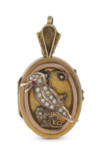 An antique Australian gold locket adorned with raised kookaburra set with ruby and seed pearls, late 19th early 20th century, 4.5cm high, 7.5 grams total