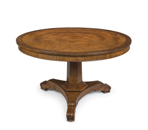 An exceptional and early Australian Colonial breakfast table, superbly crafted top made from a single butt cut slab of cedar with fine cross banded edge, hexagonal tapering column and platform base terminating in carved feet with brass castors, circa 1825