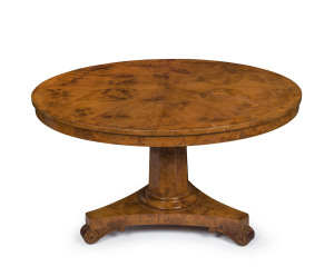 A stunning and rare Colonial huon pine breakfast table with radially veneered circular top, cross banded in huon pine, hexagonal tapering column, tri-form base, scrolling feet with inset brass castors, Tasmanian origin, circa 1835. 75cm high, 127cm diameter