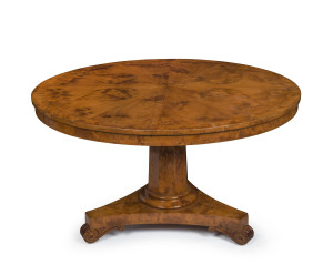 A stunning and rare Colonial huon pine breakfast table with radially veneered circular top, cross banded in huon pine, hexagonal tapering column, tri-form base, scrolling feet with inset brass castors, Tasmanian origin, circa 1835. 75cm high, 127cm diamet