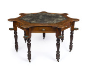 Rare Australian blackwood games table with leatherette inset and scalloped top, seven playing positions each with drawer and fold out tray plus drinks stand. Melbourne, Victorian origin, circa 1885, 77cm high, 150cm wide