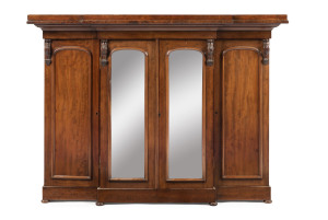 An impressive miniature mahogany breakfront wardrobe, interior attractively fitted with drawers and compartments, circa 1870, 76.5cm high, 103.5cm wide, 35cm deep