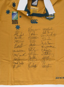 WALLABIES - 2003 WORLD CUP: commemorative team jersey hand signed by entire Wallabies World Cup squad, displayed in lockable framed perspex box, limited edition of 400, with Price Waterhouse Coopers authenticated CofA; overall 79x104x11cm. - 2