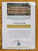 WALLABIES - 2003 WORLD CUP: commemorative team jersey hand signed by entire Wallabies World Cup squad, displayed in lockable framed perspex box, limited edition of 400, with Price Waterhouse Coopers authenticated CofA; overall 79x104x11cm. - 3