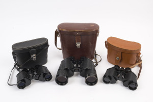 Three pairs of German leather cased binoculars, the largest pair made by "Carl Zeiss" (Jena model), the others by "Zenith Tempest" and "Hartmann-Optik", 20th century, the largest pair 20cm high, 22cm wide in case.