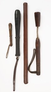 Four police truncheons and night sticks, one leather covered and lead shot filled, another made of early vulcanized rubber, one a hard wood loose head truncheon, and a novelty tourist truncheon, 20th century, the largest 54cm long,