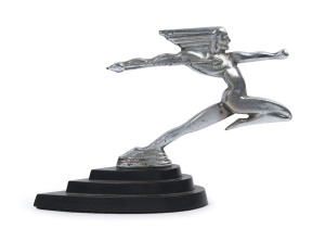 A vintage Art Deco figural car mascot, chrome finished cast metal on three tiered ebonized plinth, circa 1930, 16cm high, 23cm long overall