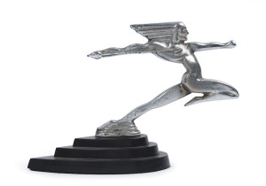 A vintage Art Deco figural car mascot, chrome finished cast metal on three tiered ebonized plinth, circa 1930, ​16cm high, 23cm long overall