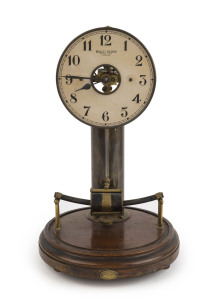 "BULLE-CLOCK" French Breveté S.G.D.G. Patented early battery operated table clock with brass cylinder stand containing the Leclanche battery cell driving electro-magnetic pendulum; original card dial with open centre displaying the motion work and contrat