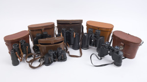 Six pairs of vintage binoculars in tan and brown leather cases, 20th century
