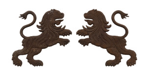 A pair of French cast iron lion plaques, 19th/20th century, 42cm high, 56cm long