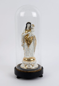 A cylindrical French glass dome containing a Virgin Mary and baby Jesus porcelain figure with gilt decoration and impressed factory mark to the base, on an ebonised plinth resting on three bun feet. 19th/20th century. Dome measurements 36cm high, 15cm wide.