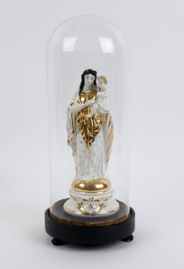 A cylindrical French glass dome containing a Virgin Mary and baby Jesus porcelain figure with gilt decoration and impressed factory mark to the base, on an ebonised plinth resting on three bun feet. 19th/20th century. Dome measurements 36cm high, 15cm wid