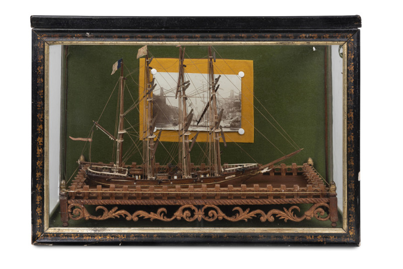 A China trade ship model in glass case with crown of thorns mount and contemporaneous photograph, 19th century, 32cm high, 46cm wide, 24cm deep
