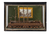 A China trade ship model in glass case with crown of thorns mount and contemporaneous photograph, 19th century, 32cm high, 46cm wide, 24cm deep