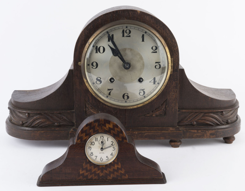 Two Napoleon hat clocks, one in oak case and one with Australian timbers, early to mid 20th century, the larger 32cm high