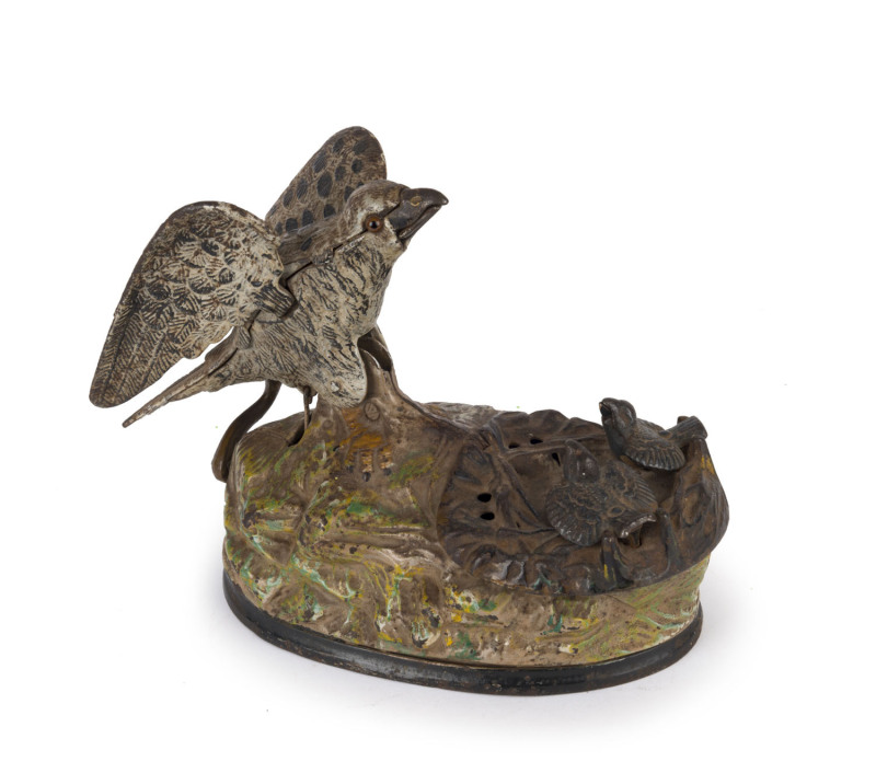 An American cast iron novelty money bank in the form of a mother bird feeding her two chicks, "PAT JAN 23 1883", cast into the base, late 19th century, 16cm high,