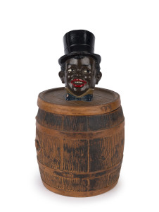An American terracotta cigar container, in the form of a wooden barrel, the lid handle depicting the head of a young black boy wearing a top hat, early 20th century, 25cm high,