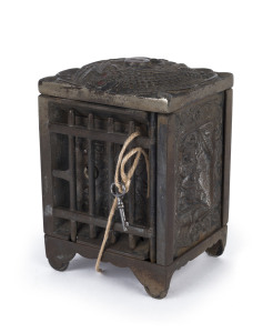 "JEWEL SAFE" an American cast and nickel plated novelty money bank safe with female cast decoration and jail bars door protecting the front safe door, (with key), early 20th century, 14cm high, 10cm wide, 8.5cm deep