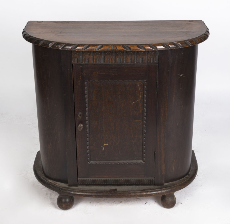 A Tudor style hardwood side cabinet, circa 1930, 76cm high, 76cm wide, 37cm deep