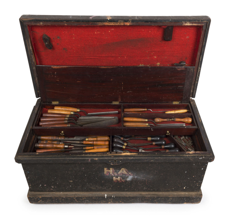 A superb fully fitted pattern maker's tool chest, late 19th century, Of cedar and pine construction with iron carrying handles, black Japanned finish and pattern maker's initials to the face, "H. A. H.".