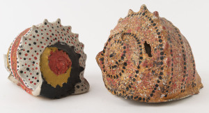 Two conch shells with Aboriginal painted decoration, 20th century, (2 items), the larger 17cm high, 21cm long, 18.5cm deep.