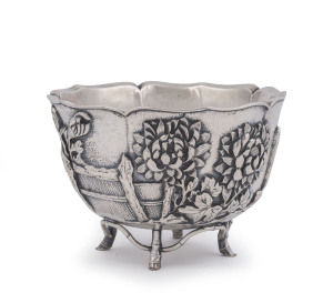 An outstanding antique Chinese silver bowl, double walled construction with superb repoussé floral decoration and stylized bamboo feet, 19th/20th century, seal mark to base, 9cm high, 13cm wide, 312 grams