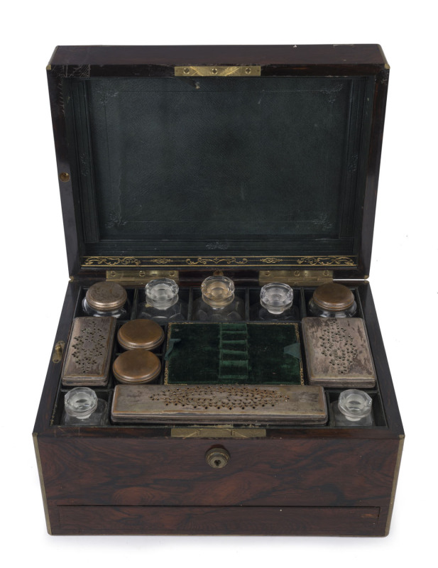 A ladies antique rosewood travel box fitted with drawers and compartments filled with various jars and bottles, mid 19th century, 18cm high, 31cm wide, 23cm deep