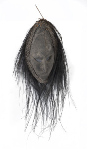 An ancestral mask, carved wood and natural fibre with feather fringe, Biwat River, Papua New Guinea, circa 1960, ​53cm high overall
