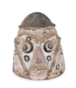 A helmet mask, carved wood, natural fibre and clay with earth pigments, Vanuatu, early to mid 20th century, ​37cm high