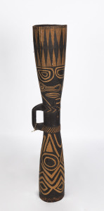 A tribal drum, carved and painted wood, Pacific Islands, 20th century, ​111cm high