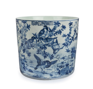 A Chinese blue and white brush pot with birds in landscape, Republic period, 20th century, Yongzheng mark to upper lip, 22cm high, 25.5cm diameter