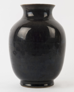 A Chinese porcelain vase with black glazed exterior, Qing Dynasty, 19th century, made in two sections, 29cm high