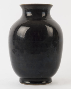 A Chinese porcelain vase with black glazed exterior, Qing Dynasty, 19th century, ​made in two sections, 29cm high