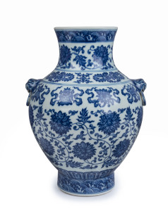 A Chinese baluster shaped blue and white porcelain vase with lotus pattern and Buddhist emblems, Qing Dynasty 19th/20th century, six character Qianlong mark to base, 31cm high