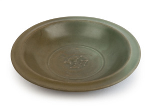 Sung antique Chinese celadon earthenware dish decorated with two fish and distinctive lip to the outer edge, 20cm diameter