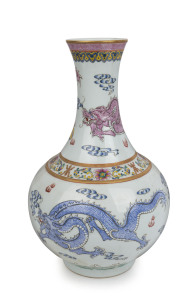 An impressive Chinese porcelain vase with three celestial dragons decorated with polychrome enamel, Republic period, 20th century, underglaze seal mark to base, ​39cm high