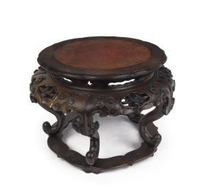 An outstanding Qing Dynasty Chinese carved wooden stand with lotus shaped top, adorned with Chinese orchids, pierced lozenges, carved clouds and Ruyi motif, 19th century, 21cm high, 30cm wide