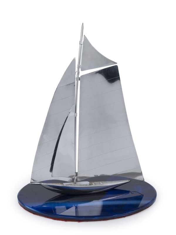 An Art Deco chrome yacht ornament on blue glass base, circa 1930, 37cm high, 31cm wide