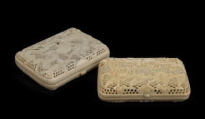Two antique Chinese cigarette cases, carved and pierced ivory, circa 1900, dragon example damaged, the larger 8 x 6cm