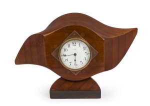 An eight day mantel clock mounted in a wooden propeller, early 20th century, 25cm high, 42cm wide